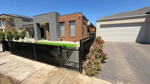 Black fence and front garden